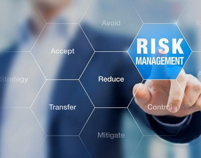 Businessman pointing at risk management concept on screen