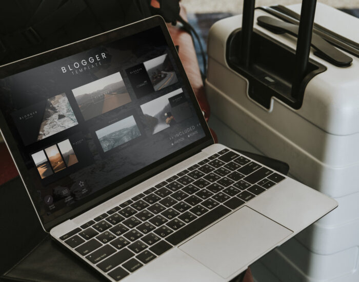 Blogger laptop by a luggage at the airport