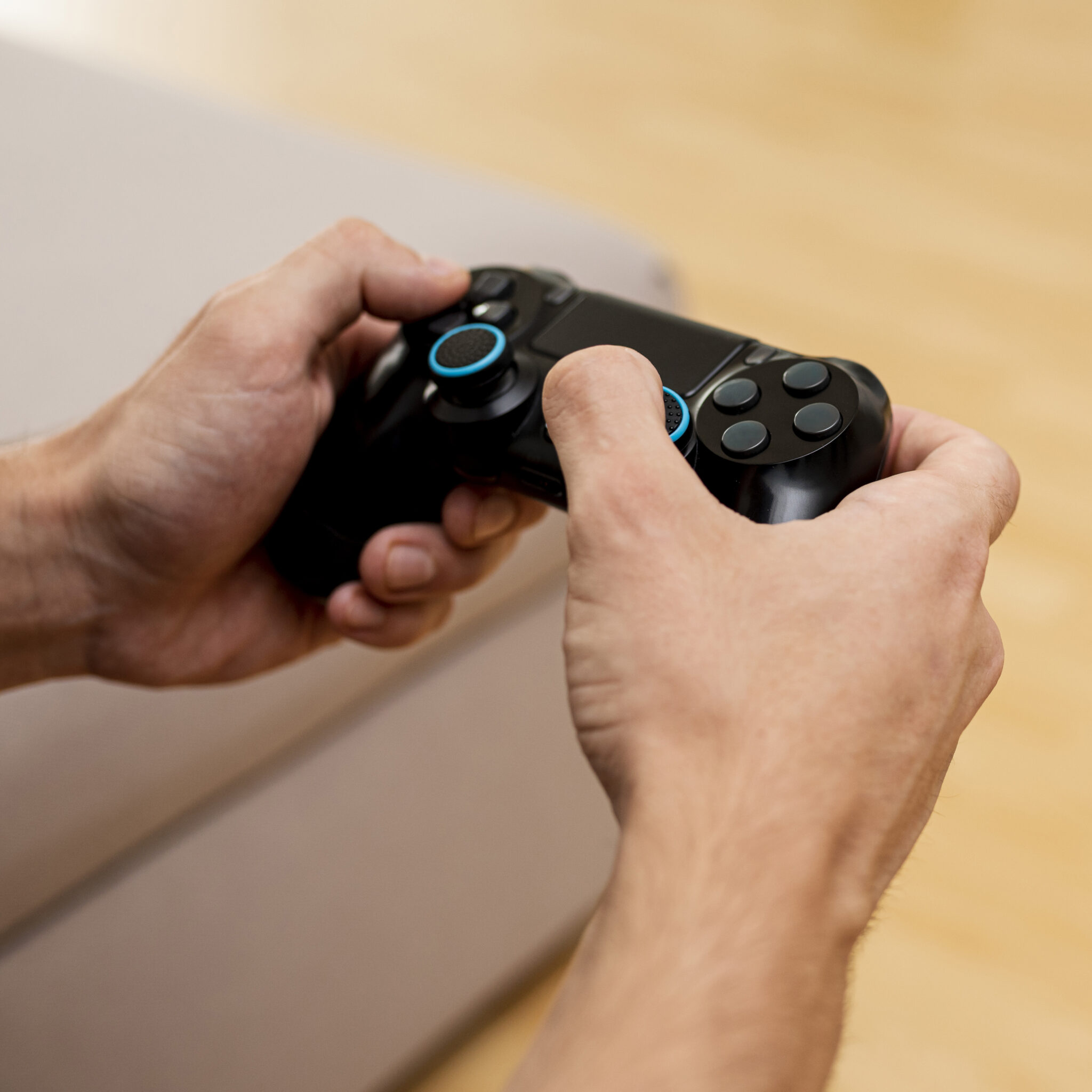 close up boy playing with game controller scaled