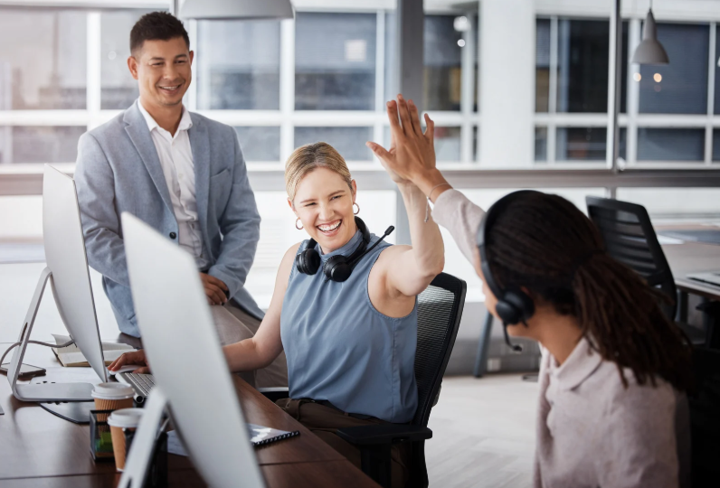 a woman giving a high five to a man